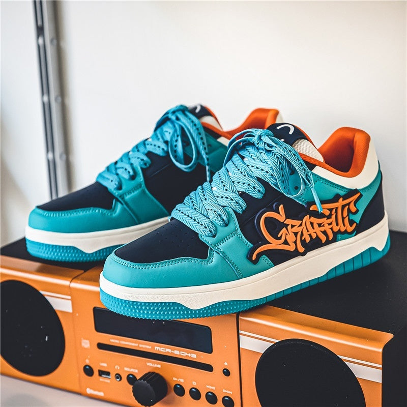 “Men’s graffiti-style thick-soled sports sneakers in teal and orange — Trend Step urban street footwear”