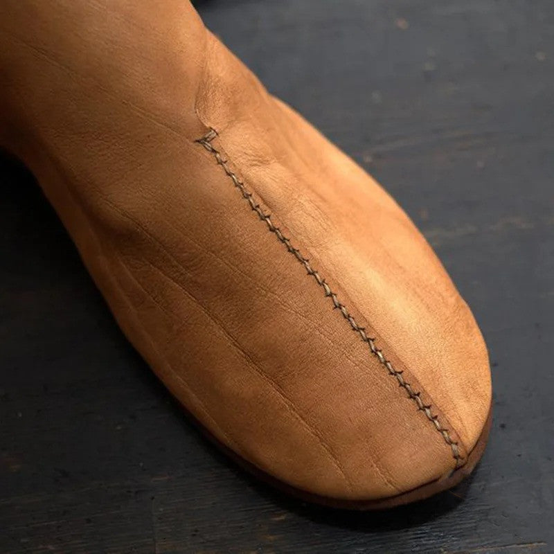 “Vintage men’s brown flat round-toe leather lace-up boots on wooden surface – Trend Step”